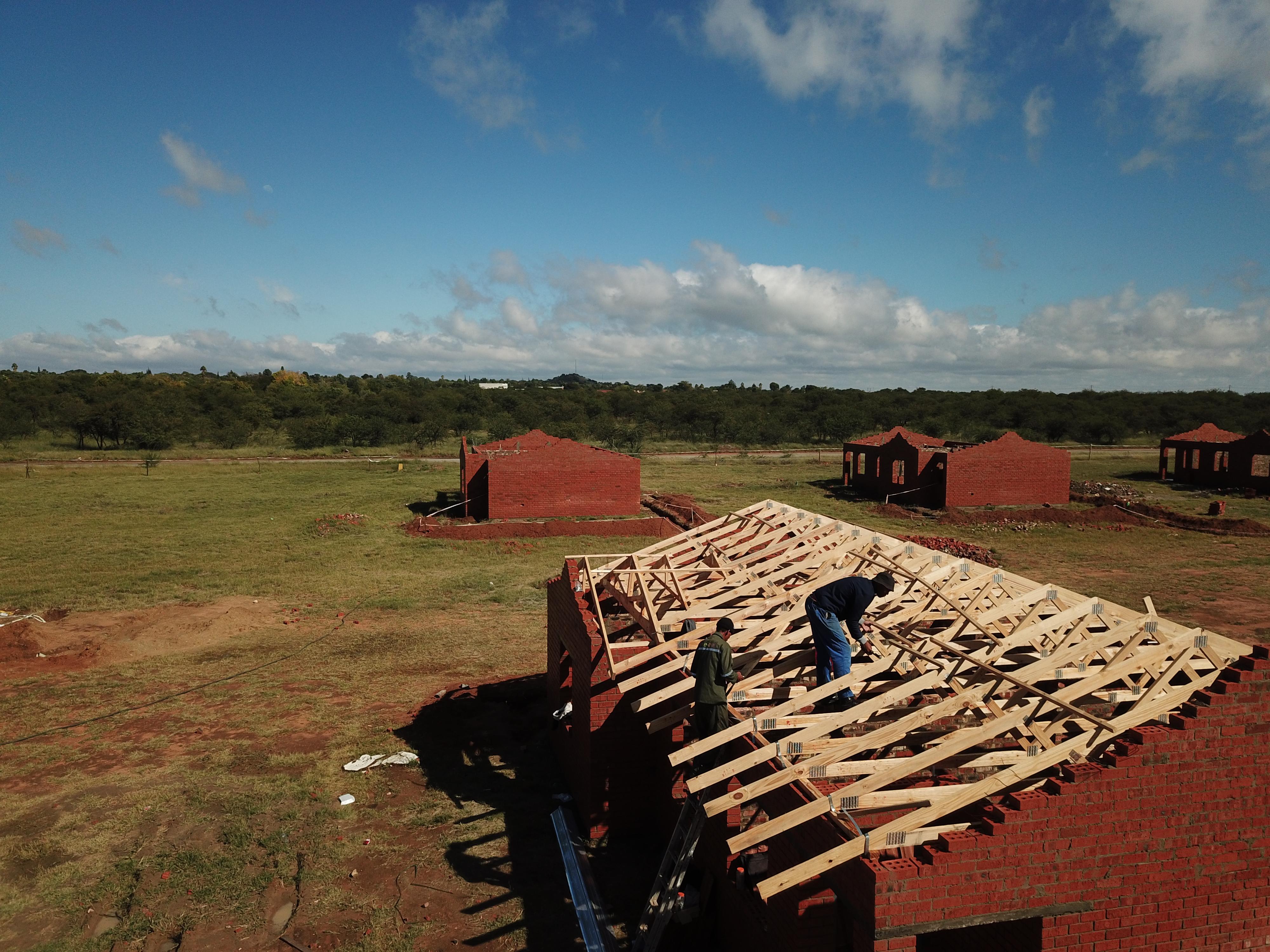 Home Slider goes here showing a man on top of a roof house